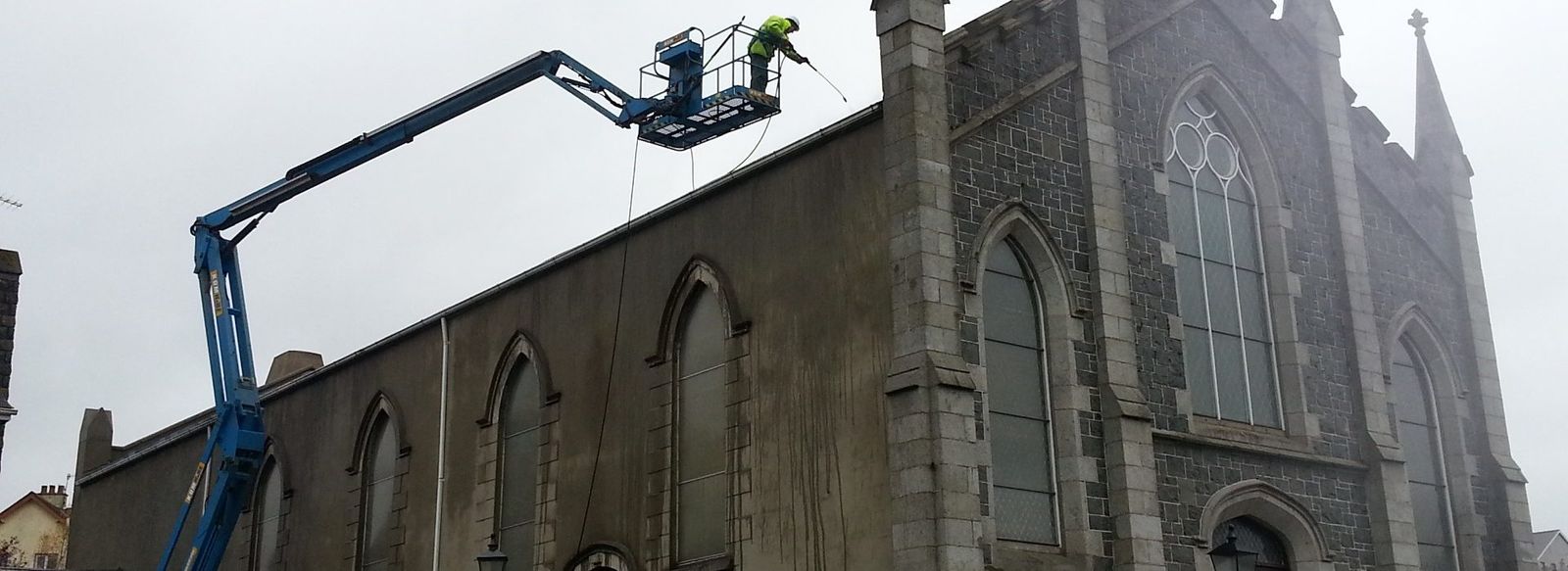 Church exterior being cleaned from an access platform