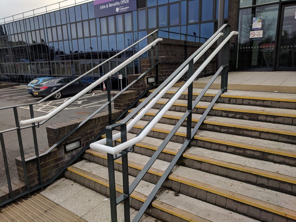 Handrails and steps recoated at a commercial entrance